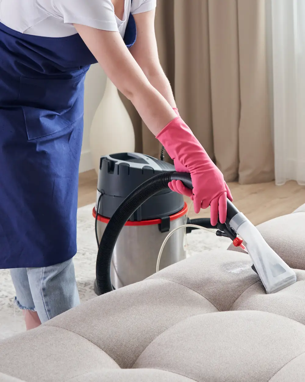 Brite Spot Household Cleaning employee vacuuming in Knoxville TN